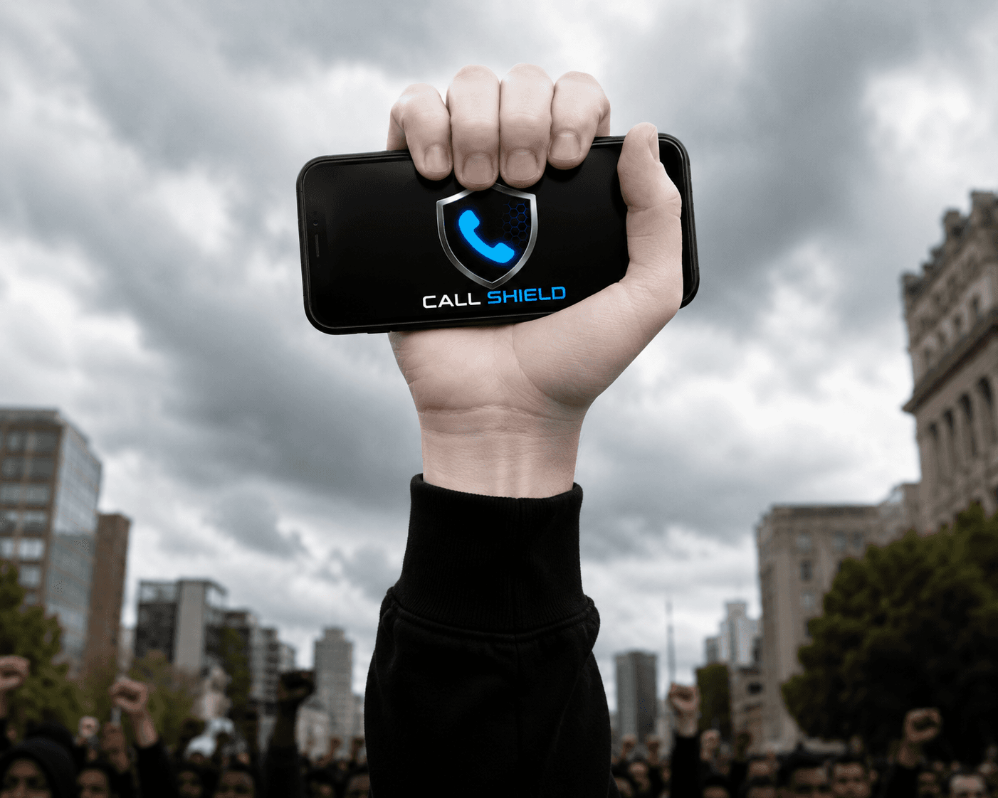 Raised hand holding a phone in front of a crowd